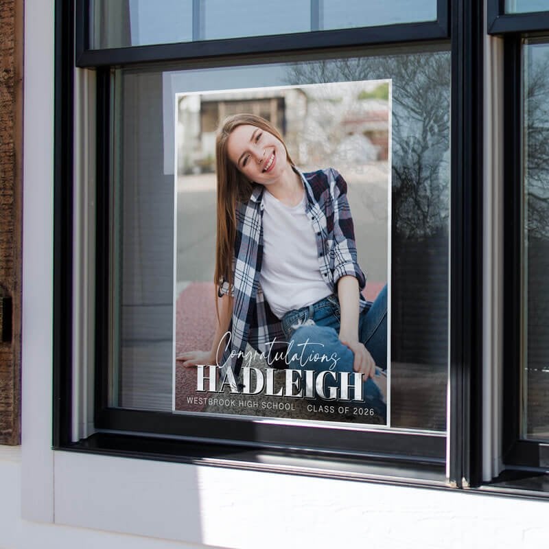 An 24x18 vertical yard sign for a graduate in a window
