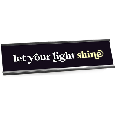 Black desk plate with white custom text in aluminum holder