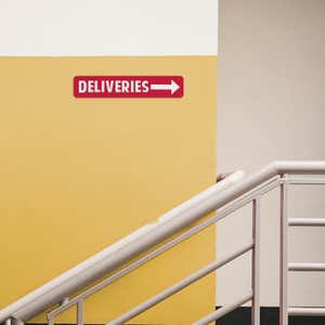 Red 2 By 10 Plastic Sign With Text And A Symbol