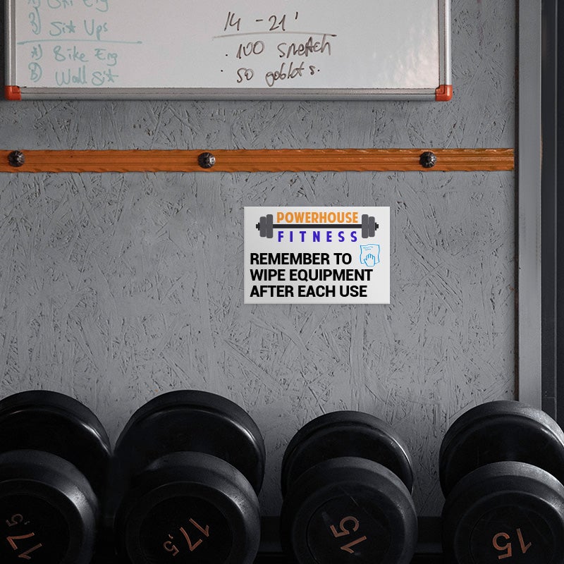 A Custom Plastic Sign for a Gym with a Colorful Logo and a Message to Gym Members