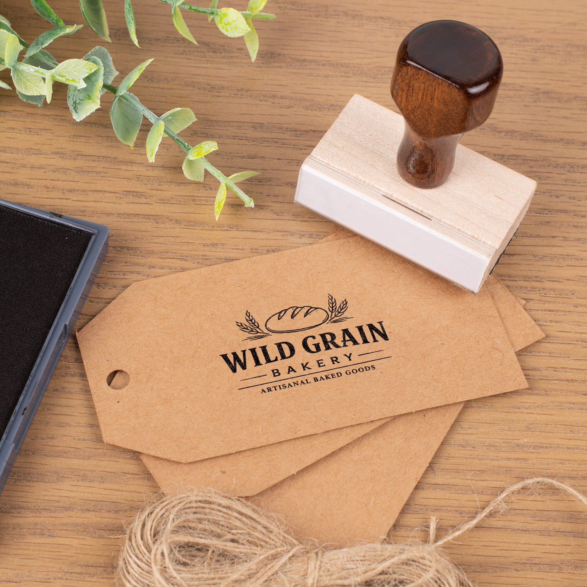 Custom wood stamp creating bakery logo impression