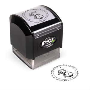 Pre-inked stamp shown from above featuring custom ‘Cute Snowflake Catcher’  holiday return address design.