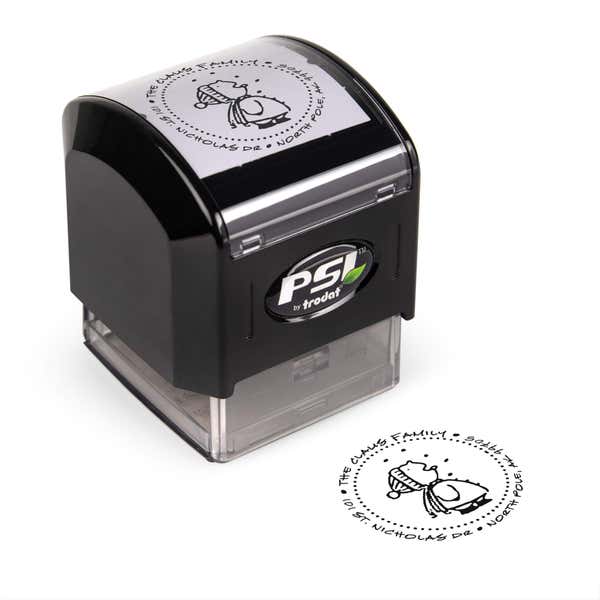 Pre-inked stamp shown from above featuring custom ‘Cute Snowflake Catcher’  holiday return address design.