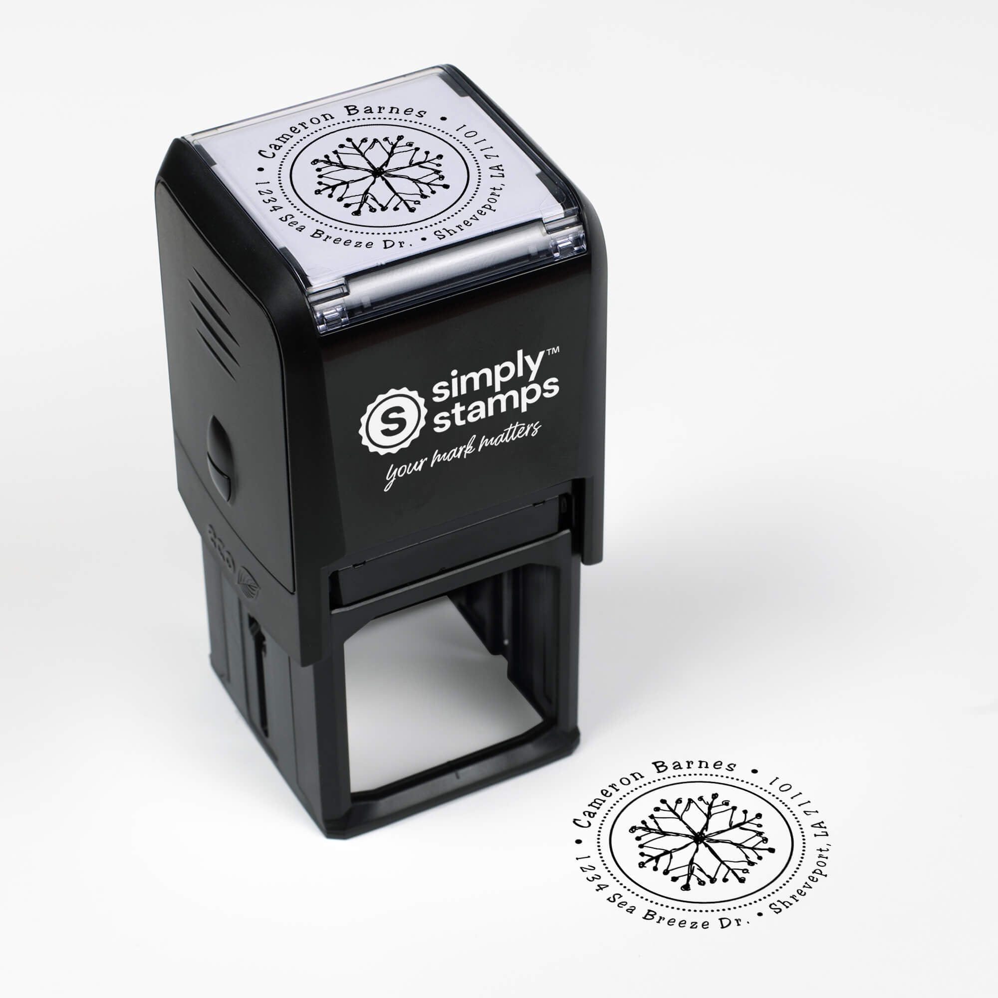 Top angle view of self-inking holiday stamp with circular ‘Hand Drawn Snowflake’ address design.