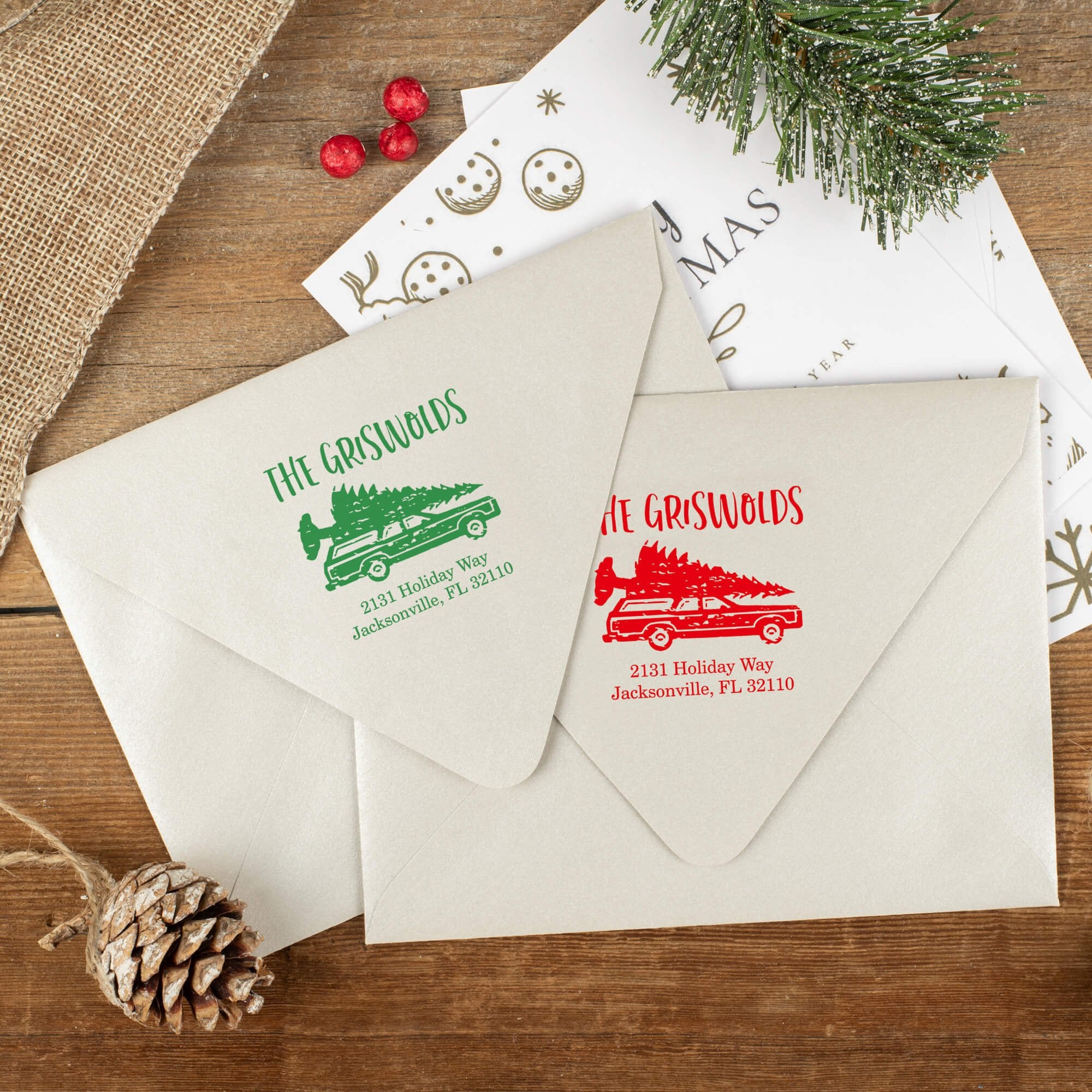 Green and red ink impressions of ‘Griswold Holiday’ return address stamp on Christmas envelopes.