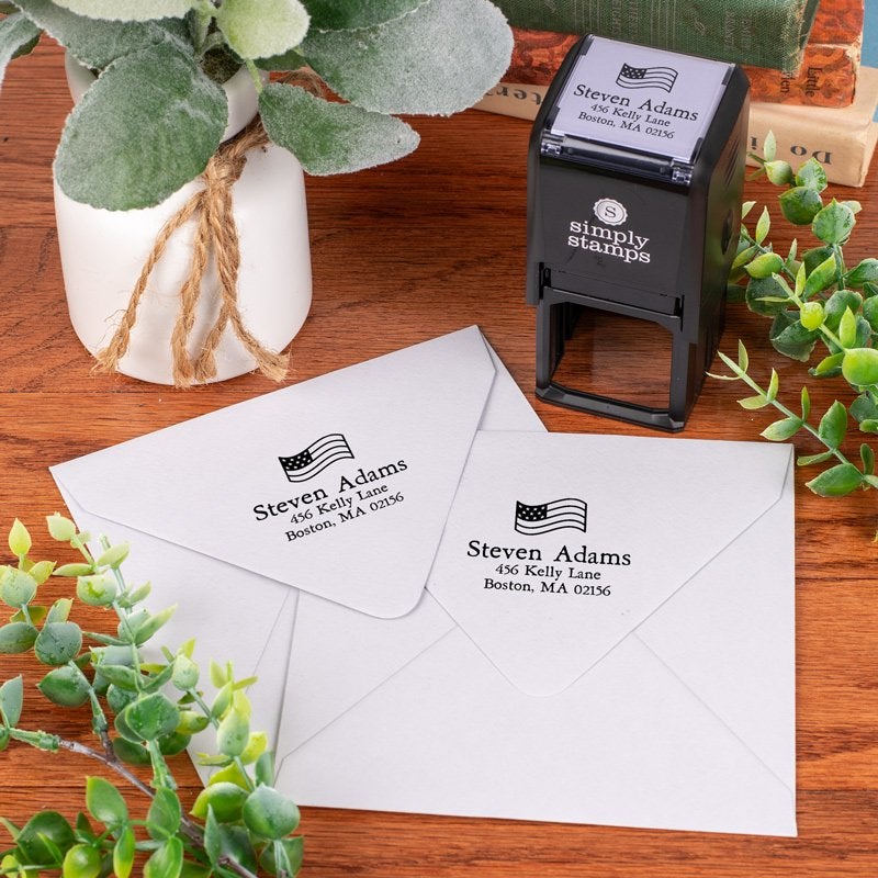Address stamp impression with american flag above address on two envleopes
