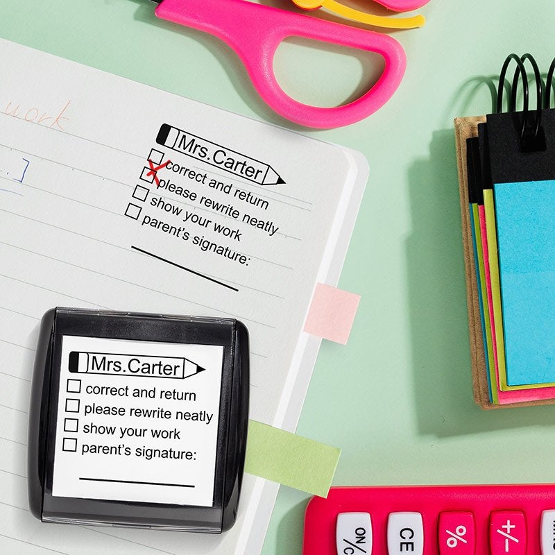 Teacher Grading Stamp impression on school notebook