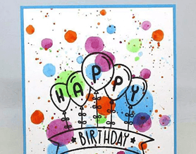 Handmade happy birthday card with paint splatter and balloons