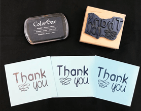 Wood handle rubber stamp with thank you impressions