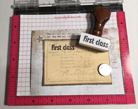 Decorated envelope with a wood handle stamp