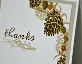 Rustic thank you card with pine cones and a thank you stamp