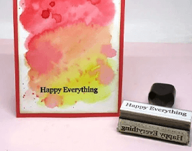 Happy everything watercolor craft card with a traditional wood handle stamp