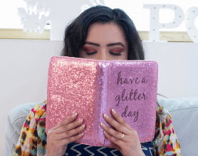 Woman Reading her Pink Journal