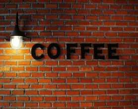 Brick Wall with the Word Coffee